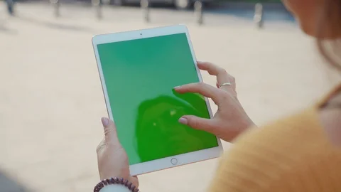 Close up hands woman using touch tablet device computer with green screen Stock Footage 116440465