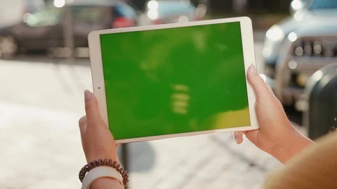 Close up hands woman using touch tablet device computer with green screen Stock Footage 116441514