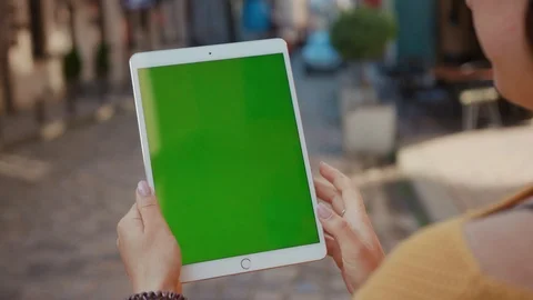 Close up hands woman using touch tablet device computer with green screen Stock Footage 116442022