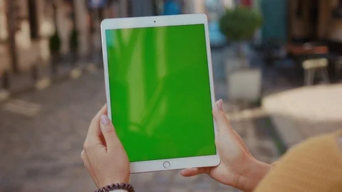 Close up hands woman using touch tablet device computer with green screen Stock Footage 116442028