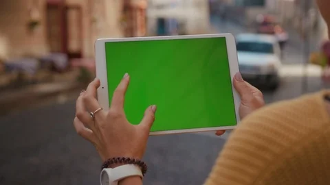 Close up hands woman using touch tablet device computer with green screen Stock Footage 116444039