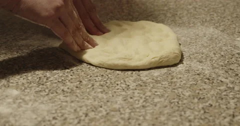Close up of hands of woman while kneading Italian pizza - 4K DCI slow motion Stock Footage 152147783