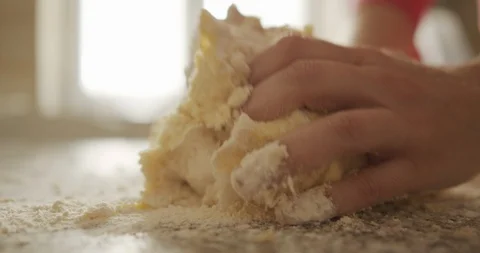 Close up of hands of woman while Mixes flour And Potatoes To prepare Traditio Stock Footage 129066427
