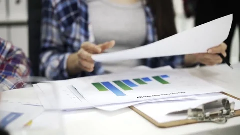 Close up of hands of woman working with graphs Stock Footage 74244874