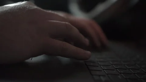 Close-up of hands work behind a laptop keyboard. Footage. Beep, scroll, press Stockbeeldmateriaal 167683527