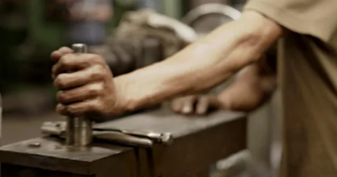 Close-up at hands of worker using industrial factory spare parts manufacturing Видео 168940964