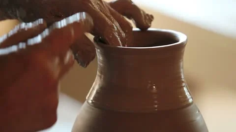 Close up of hands working clay on potter's wheel Stock Footage 8960791