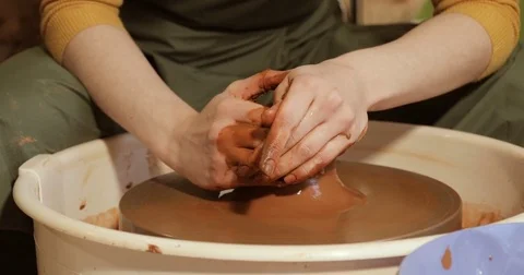 Close up of hands working clay on potter's wheel Stock Footage 74728539