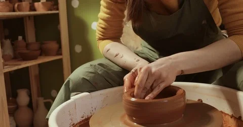Close up of hands working clay on potter's wheel, close-up view Stock Footage 74734021