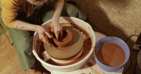 Close up of hands working clay on potter's wheel, close-up view Stock Footage 74734248