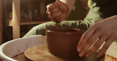 Close up of hands working clay on potter's wheel, close-up view Video stock 74735213