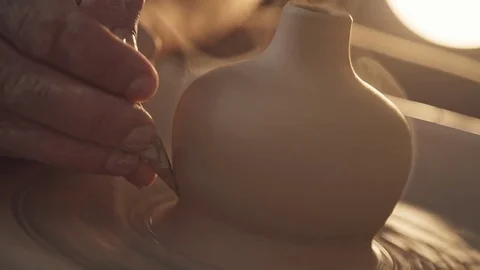 Close up of hands working clay on potter's wheel. Video stock 83623232