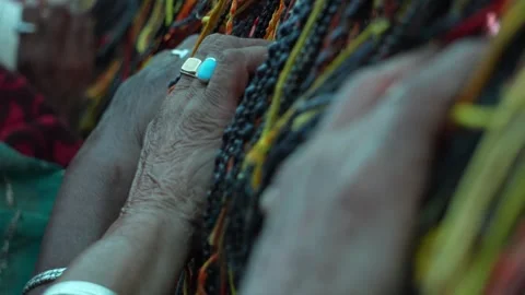 Close-Up of Hands Working with Colorful Threads spitual hindu dharma concept Stock Footage 333594624
