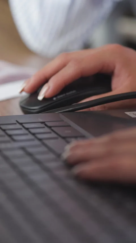 Close-up of hands working with a computer keyboard and mouse Stock Footage 344321985