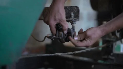 Close-Up,hands Working Install in Place of The Broaching Roller Sawmill,cleared Stock Footage 76641906
