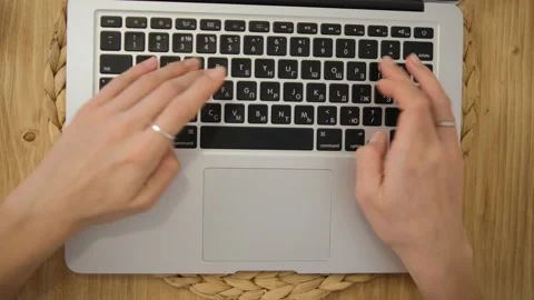 Close-up of hands working on the keyboard. Remote work. Typing text. A laptop. W Stock Footage 148471631