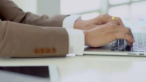 Close up hands working on laptop keyboard Stock Footage 77717491