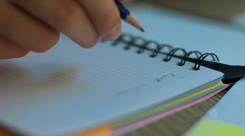 Close up of hands writing on a notebook Stock Footage 68599508