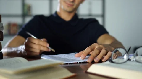 Close-up Hands Writing Notes in the Notebook, Smiling, Studying Student, Books Stock Footage 93298769