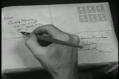 Close-up of hands writing return address on parcel Video stock 11355806