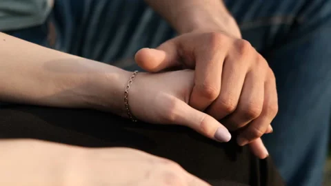 Close-up of the hands of a young couple in love. Video stock 111100932