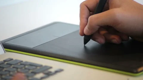 Close up of hands of a young creative individual artis using a Wacom tablet Stock Footage 62802533