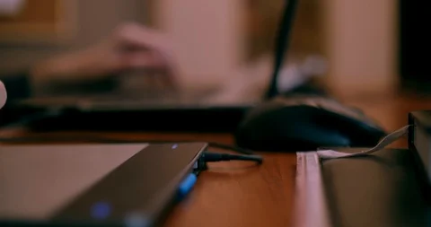 Close up of hands of a young designer using a tablet and a laptop computer 4k Vídeo Stock 87324452