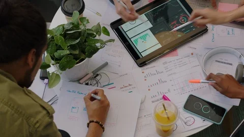 Close up hands young engineers developing fitness app software using digital Stock Footage 96890515