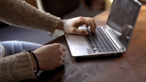 Close up on hands young freelancer working on laptop at the lft office Stock Footage 126238973