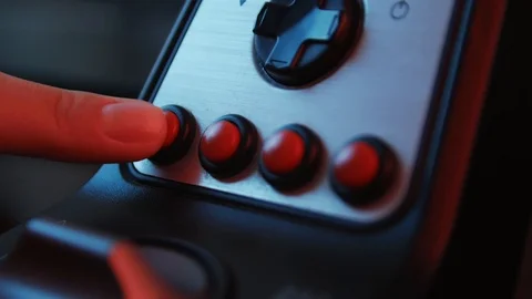 Close-up of the hands of a young gamer behind the steering wheel of a racing  Stock Footage 113546775
