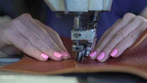 Close-Up of Hands of a Young Girl Doing a Double Stitch on the Sewing Machine Stock Footage 76124155