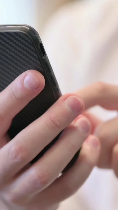 Close up of Hands of Young Man Using Smartphone, Vertical Video Vidéo 340034413