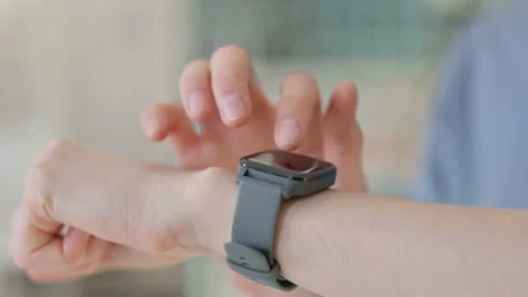 Close up of Hands of Young Woman using Smartwatch Stock Footage 151250601