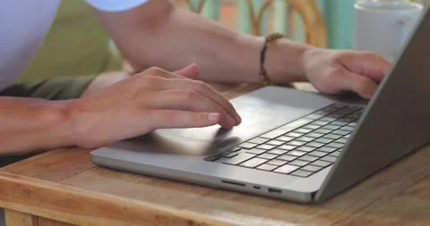 Close-up handshacker attack on the keyboard sitting indoors cafe or living room Video stock 237074093