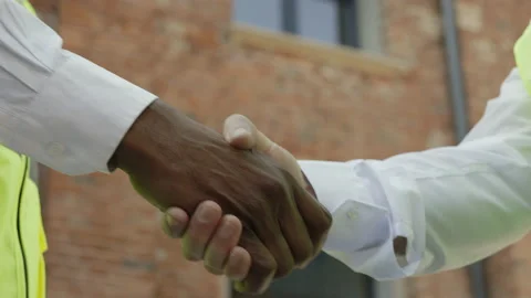 Close up of handshake between architect and engineer outside Stock Footage 196350247