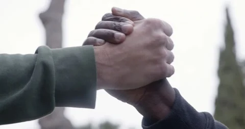 Close up handshake between black and white hands unity concept Stock Footage 333198168
