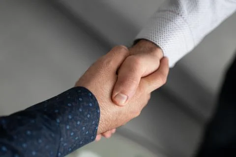 Close-up handshake in corporate environment Stock Photos