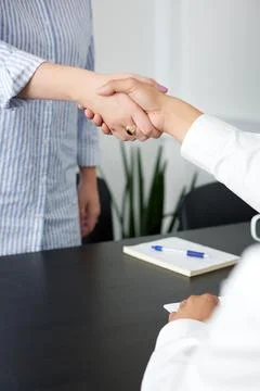Close up of handshake in the office Stock Photos