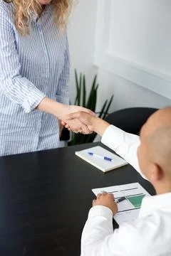 Close up of handshake in the office Stock Photos