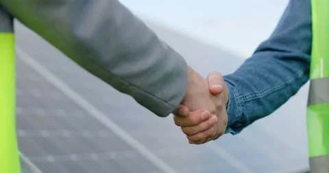 Close up of handshake on solar panel background outside. Female engineer shakes Stock Footage 139508045