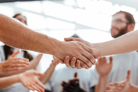 Close up. handshake of two students on the background of the st Foto stock
