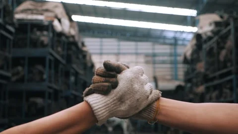 Close up of Handshake two workers in factory, Slow motion. Video stock 156384167