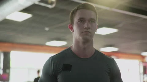 Close up handsome athletic man performing Side raise exercise with dumbbells at Stock Footage 180207514