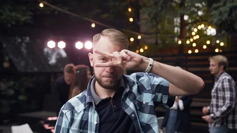 Close up of handsome bearded young man in stylish shirt rythmic dancing and Stock Footage 116657332