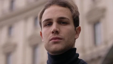 Close-Up of a Handsome Blonde Young Man with a Deep Gaze Stock Footage 304973406