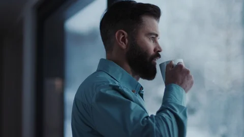 Close up handsome businessman drinking coffee and admire view standing by window Stock Footage 112161167