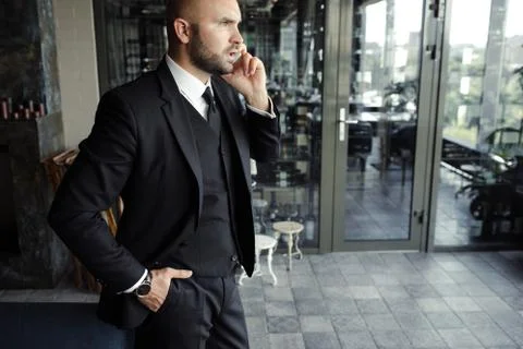 Close up of handsome businessman, working on laptop in restaurant Stock Photos