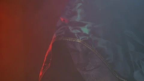 Close-up, Handsome Guy in Chen Hood with the Beast's Make-up on the Face Raises Stock Footage 88446833