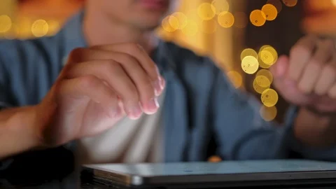 Close up Handsome guy is using a digital tablet while sitting at the bar counter Stock Footage 122013826