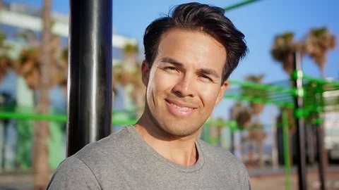 Close up of handsome Hispanic guy emotional smiling and laughing at morning Stock Footage 109419069
